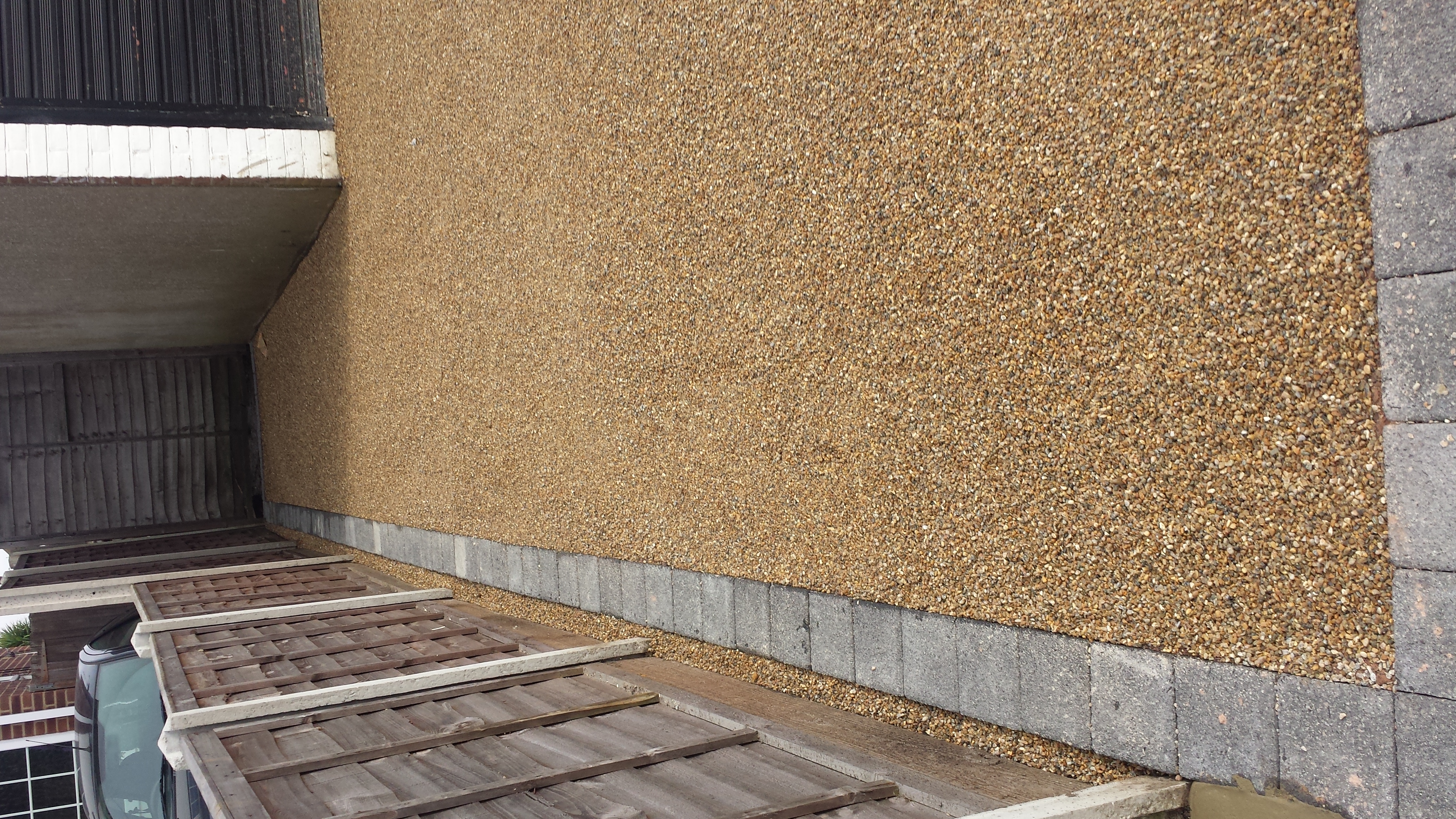 Long rural driveway after tar and chip with even stone surface